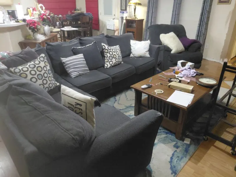 Charcoal gray sofa, loveseat and recliner with mission style wood coffee table