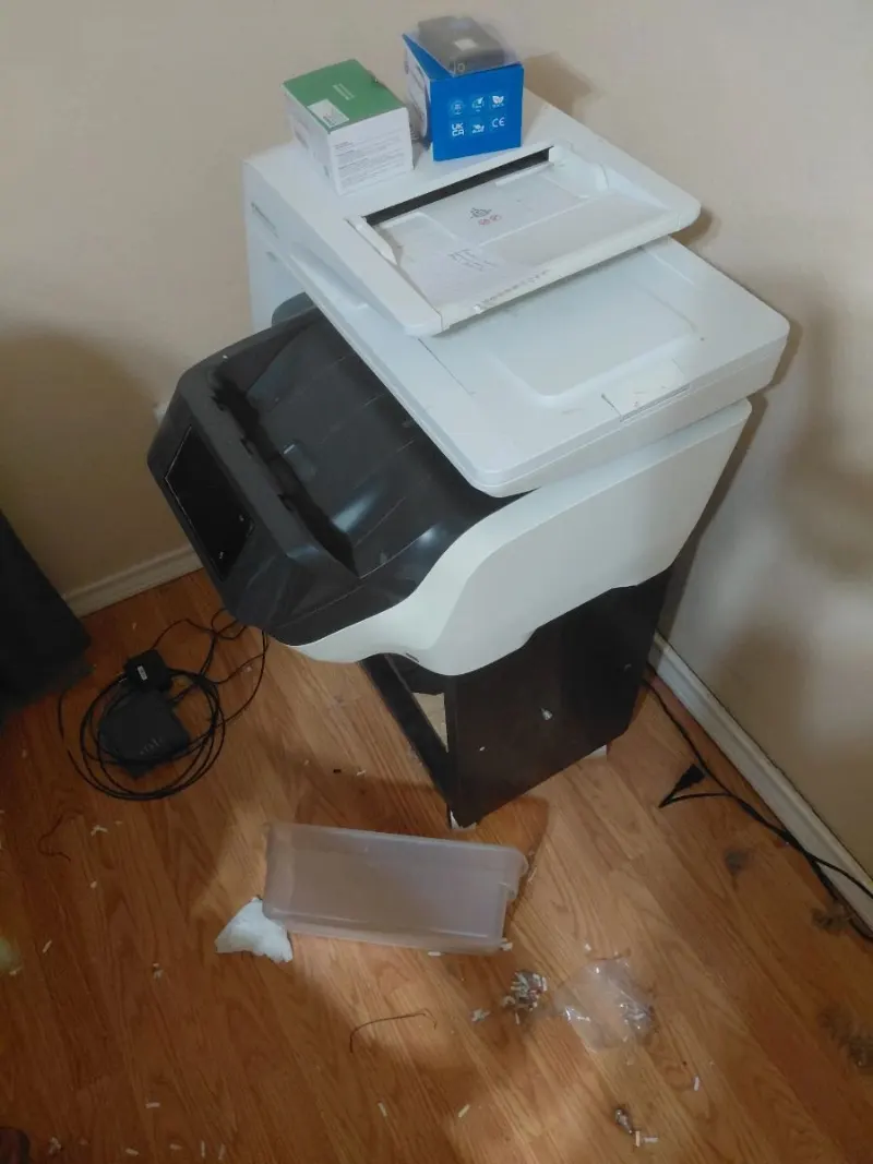 White all-in-one laser printer with document feeder on dark wood stand